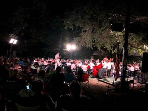 A post-dusk image of MSO on the grounds of the Cedars in Fondren for Symphony at Sunset.